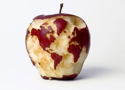 A picture of an apple partially eaten, where the skin remaining resembles the earth